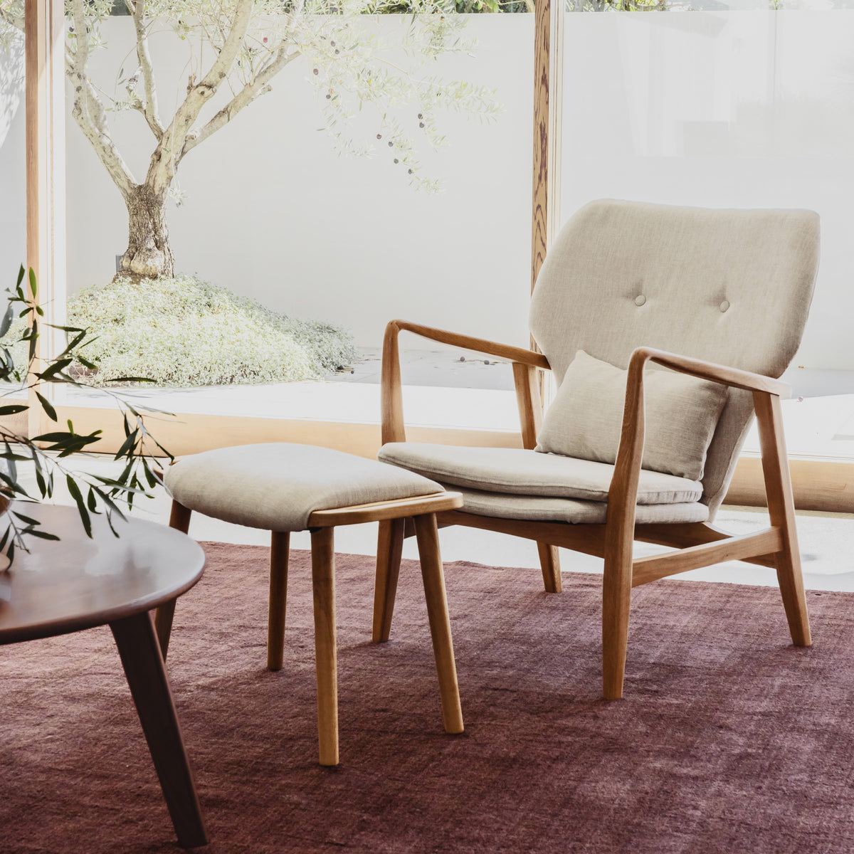 franz-armchair-oatmeal-beige-LI9DA1--lifestyle-front-right-with-footstool.jpg