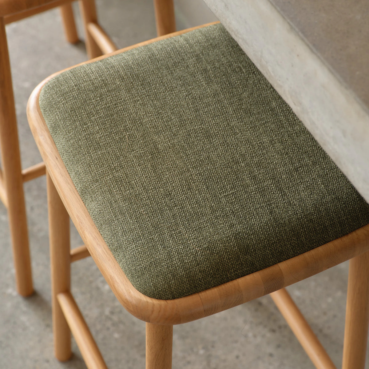 iconbydesign-anton-bar-stool-oak-aloe-green-fabric--DF8FA1--lifestyle.webp