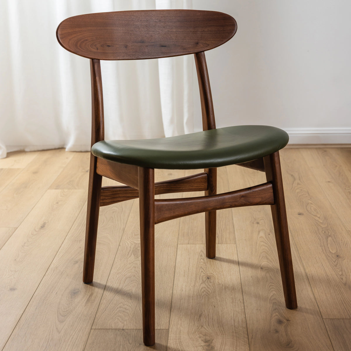 iconbydesign-magnus-dining-chair-walnut-green-leather--DF2AB1--studio_shot-front-right.webp