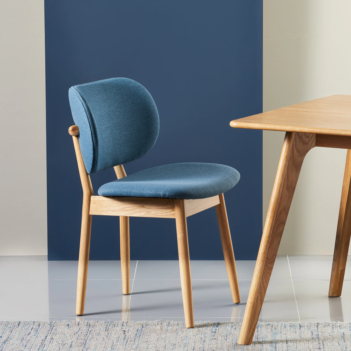 iconbydesign-olivia-dining-chair-oak-denim-blue-fabric--DF3MA1--studio-d_staged-front-right.webp